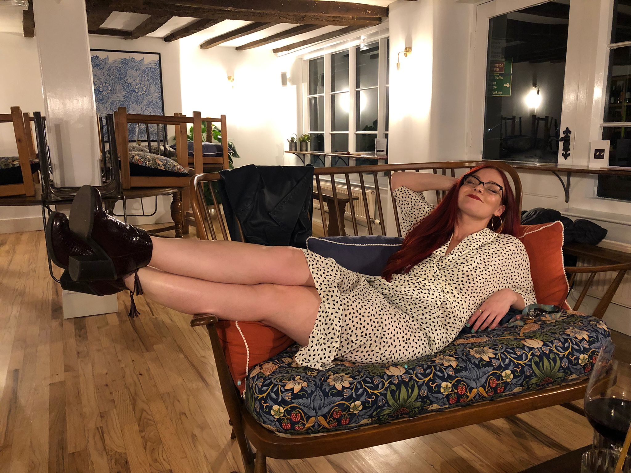 Amy relaxing on a sofa